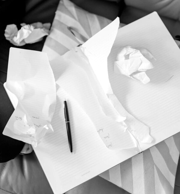 Photo by (via Pexels): Kaboompics.com: https://www.pexels.com/photo/crumpled-papers-and-notebook-with-torn-pages-6029137/
